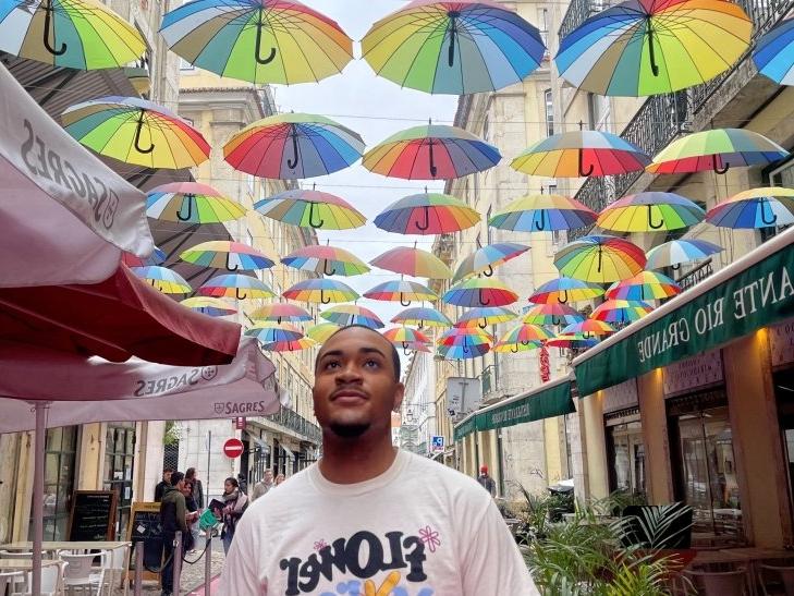 Quentin Jenkins stands under umbrellas in England. 